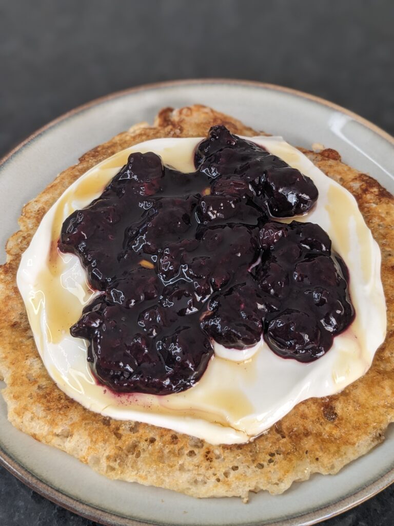 Cottage cheese pancake with Greek yogurt and blueberry sauce